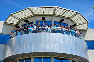 Minitab interns standing on the balcony at Minitab headquarters building